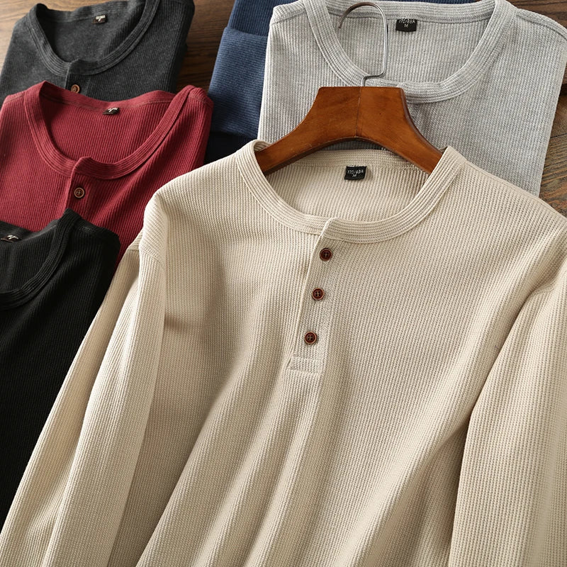 Breathable men's long sleeve henley shirt, a comfortable waffle top for versatile wear.