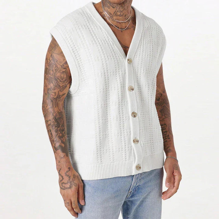 Men's white knitted vest with button front. Sleeveless textured knit, ideal for a stylish summer layer.