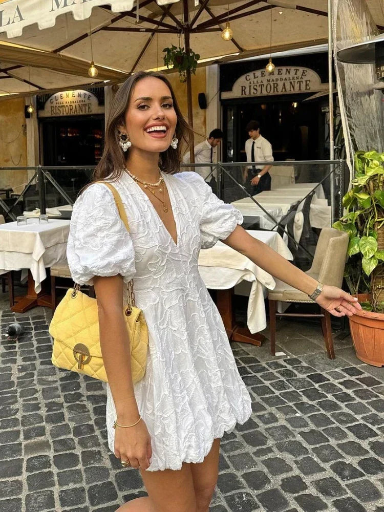 Women's romantic floral mini dress, white with puff sleeves, perfect for elegant summer and casual day wear.