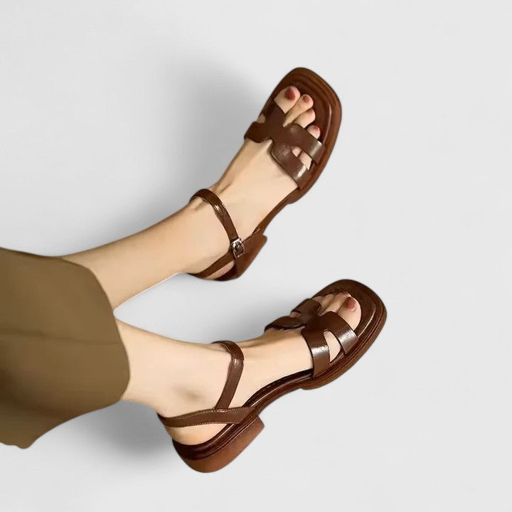 Comfortable women's flat sandals with adjustable straps. Chic ladies summer footwear for casual wear and everyday elegance.