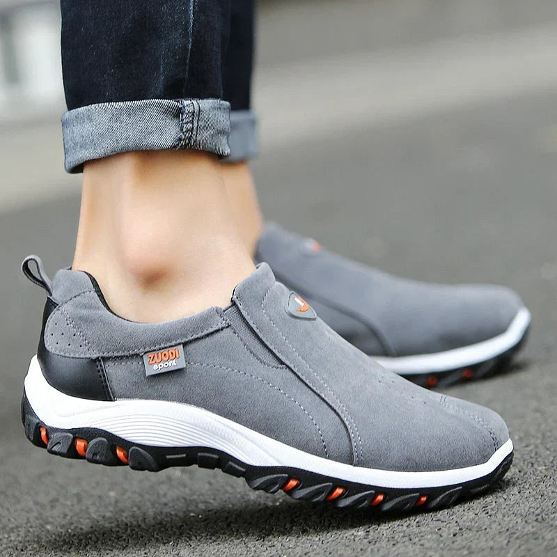 Men's black slip-on sneakers, lightweight & comfortable, ideal for casual activities & walking.