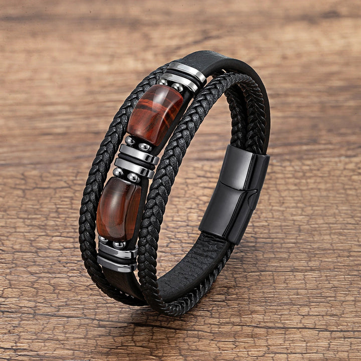 Angled shot of a stylish men's tiger eye braided bracelet, a natural stone everyday accessory.