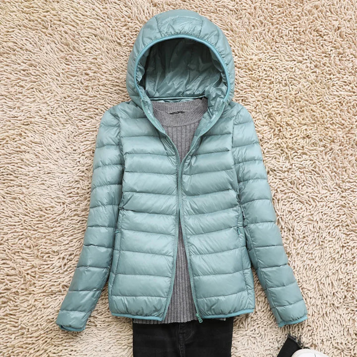 Lightweight women's insulated jacket with hood. Perfect winterwear, weather-resistant & comfortable.