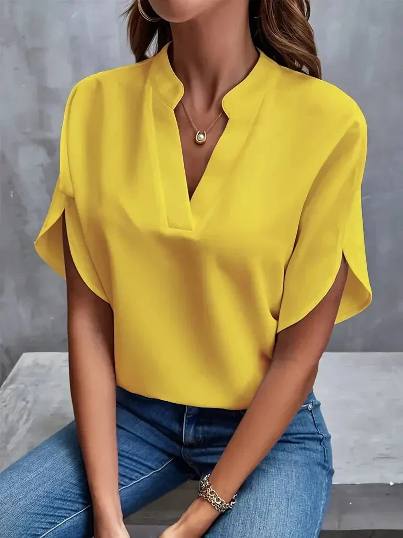 Lightweight women's summer V-neck top with an elegant design and practical side slits.