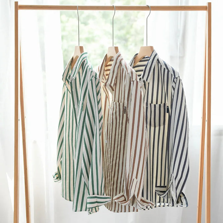 Stylish men's button-front shirt with long sleeves and a striped pattern, perfect for a modern casual top.
