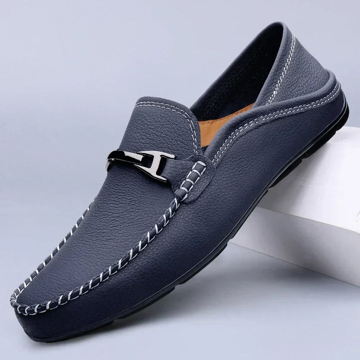 Classic men's brown leather loafers, ideal for refined comfort & versatile everyday wear.
