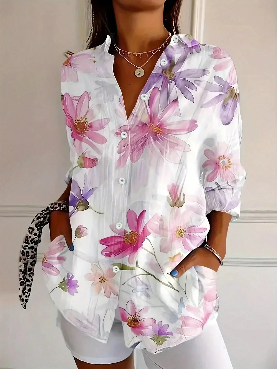 Versatile women's abstract print button-front blouse. Long sleeve, collared, relaxed fit top for effortless style.