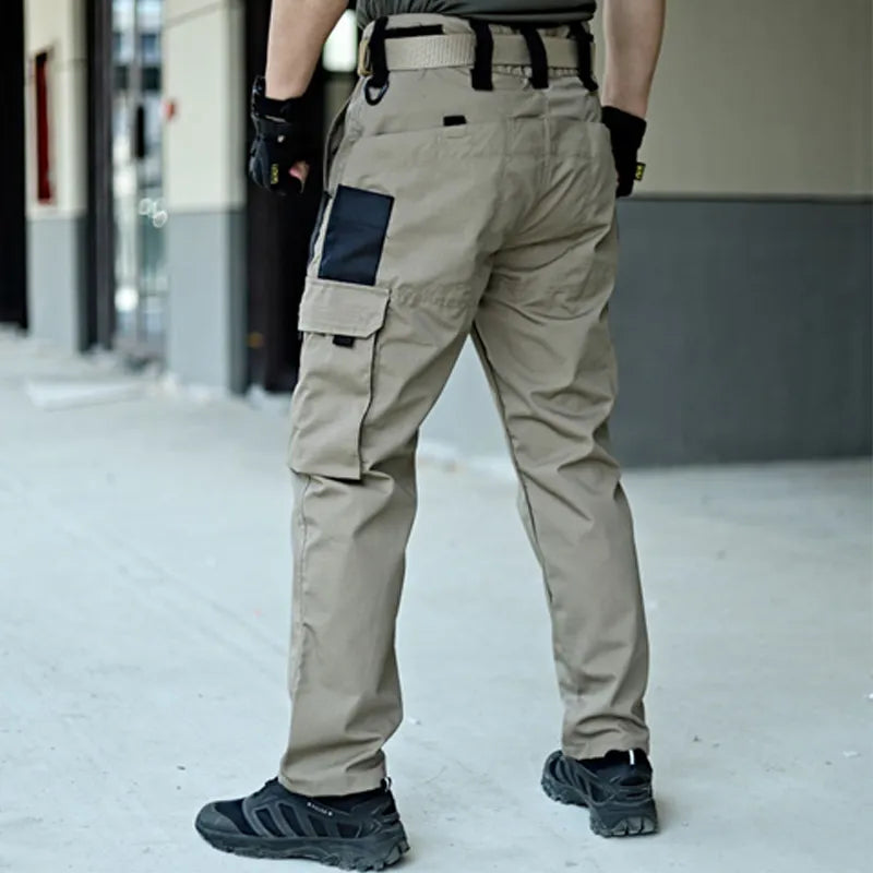 Unisex Elite Tactical Cargo Pants in army green for outdoor adventures & everyday wear. Durable & functional utility pants.