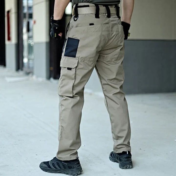 Unisex Elite Tactical Cargo Pants in army green for outdoor adventures & everyday wear. Durable & functional utility pants.