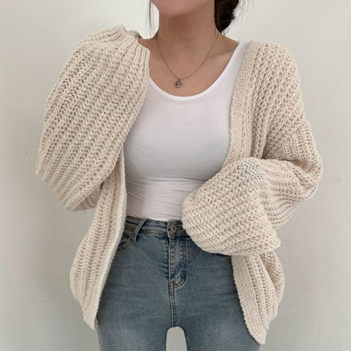 Chic women's chunky knit cardigan. Balloon sleeve, relaxed fit for casual fashion & everyday layering.