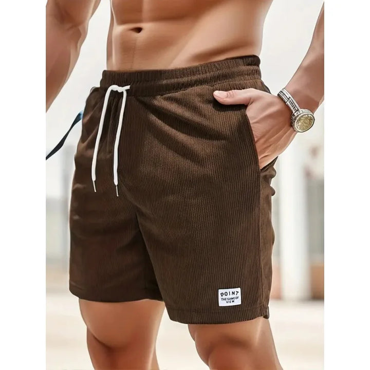 Relaxed fit men's casual shorts with a comfy drawstring waist, perfect for summer adventures.