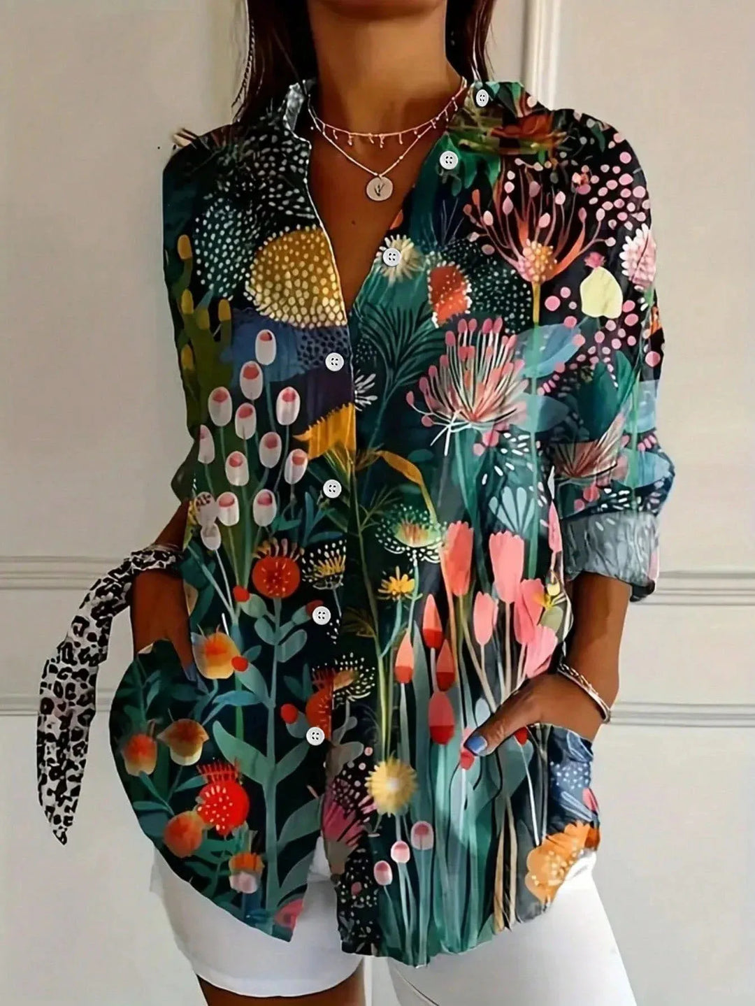 Effortless women's abstract print long sleeve blouse. Button-front, collared top in a relaxed, versatile fit.