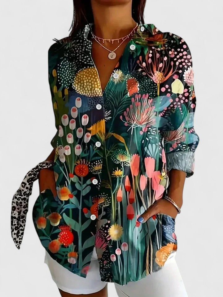 Chic women's floral print blouse, offering a modern, sophisticated look for any casual or elegant fashion occasion.