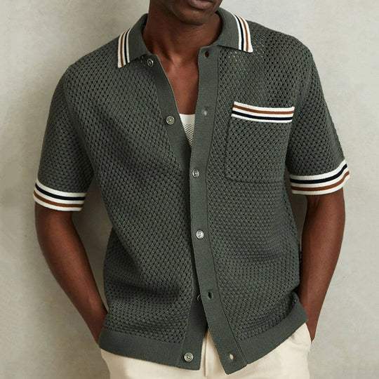 Men's stylish short sleeve polo shirt for casual comfort. Features button-front and textured fabric, perfect for summer.