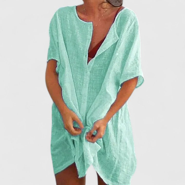 Plus size women's elegant tunic dress, designed for comfortable and chic summer fashion, flattering all figures.