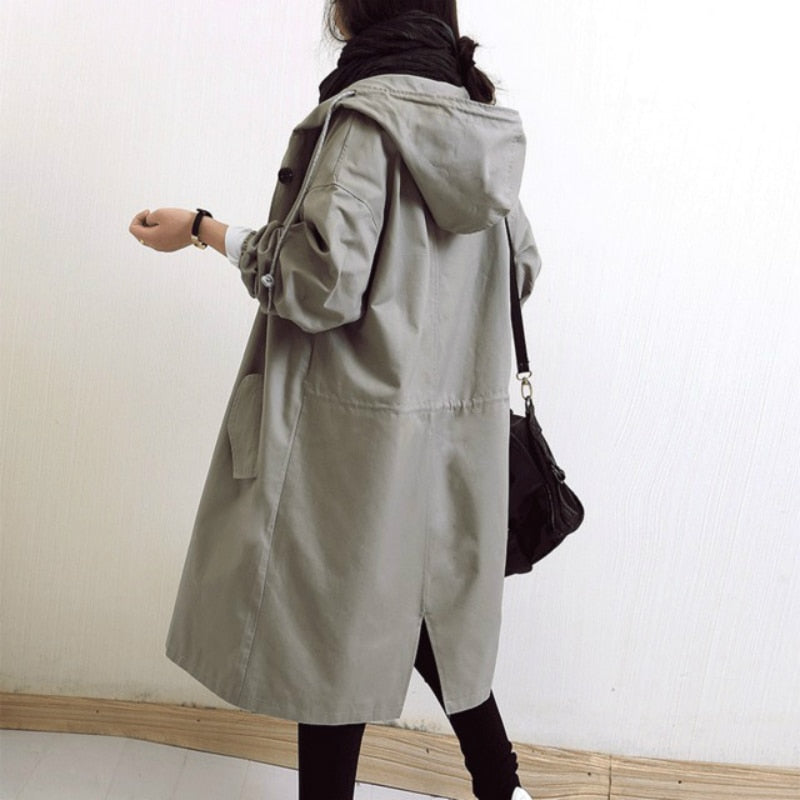 Trendy women's hooded trench coat. Elegant fall & spring outerwear, available in plus sizes for versatile style.