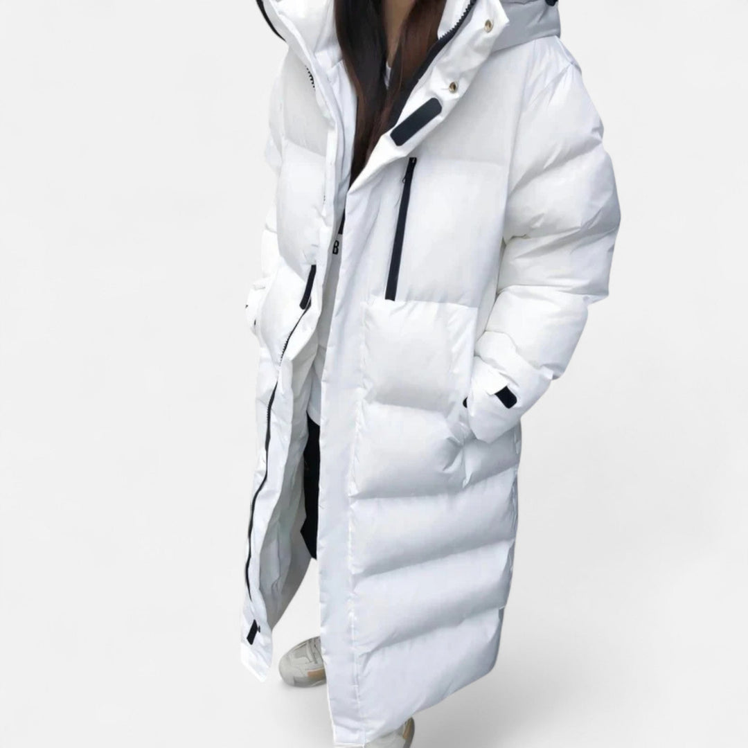 Fashionable women's long puffer jacket. A warm, elegant, and chic winter coat for seasonal style.