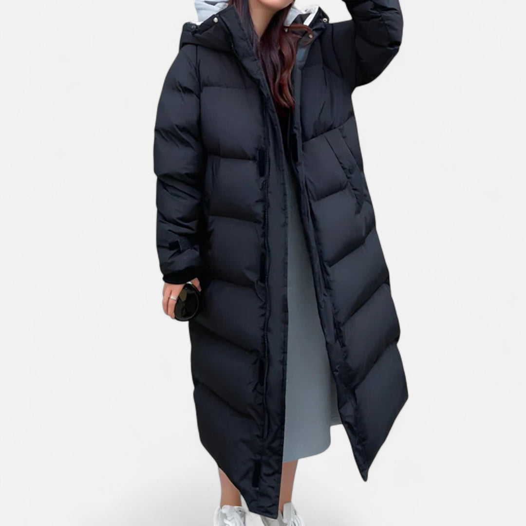 Elegant women's long puffer jacket, weatherproof & warm winter coat. Chic ladies' outerwear for fashion.