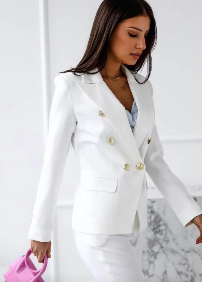Detailed shot of the top from an elegant women's two-piece set, soft and stylish.