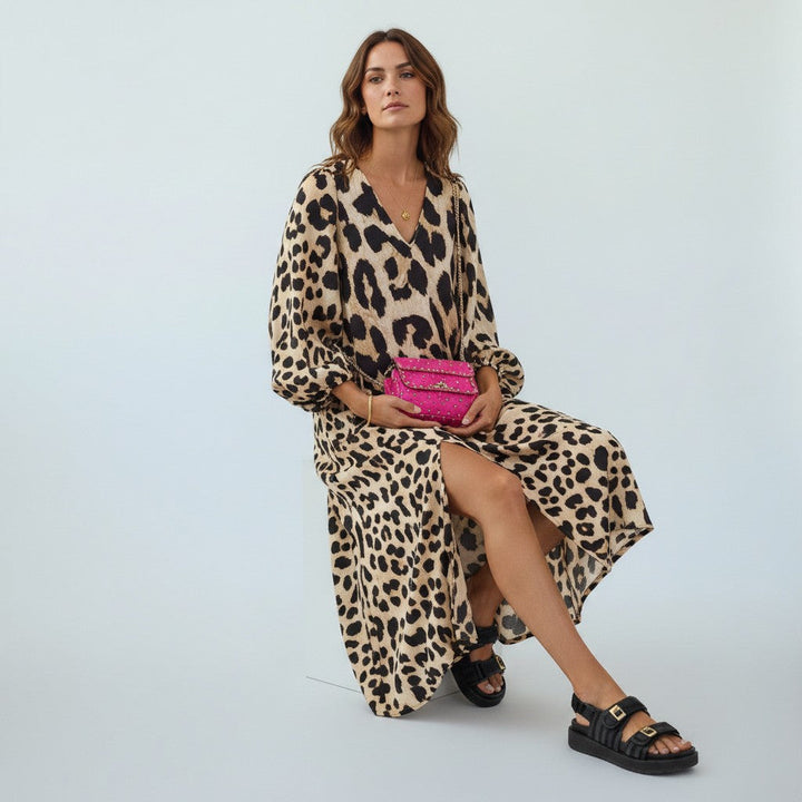 Elegant women's leopard print midi dress with a flattering fit, perfect for parties & summer occasions.