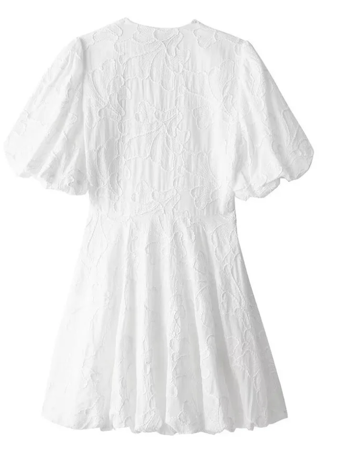 Effortless romantic white floral mini dress for women, with puff sleeves, ideal for chic summer day wear.