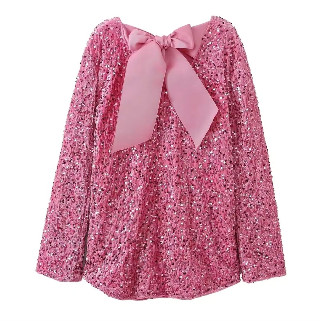 Sleeveless sequin party dress, sparkling & glamorous, with a chic back bow. Ready for "sparkle season".