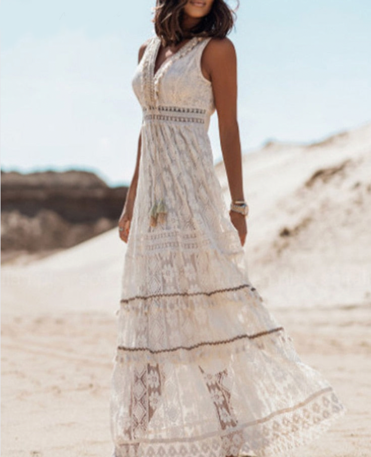 Stylish women's boho flowing maxi dress, perfect for festival fashion & warm weather comfort.
