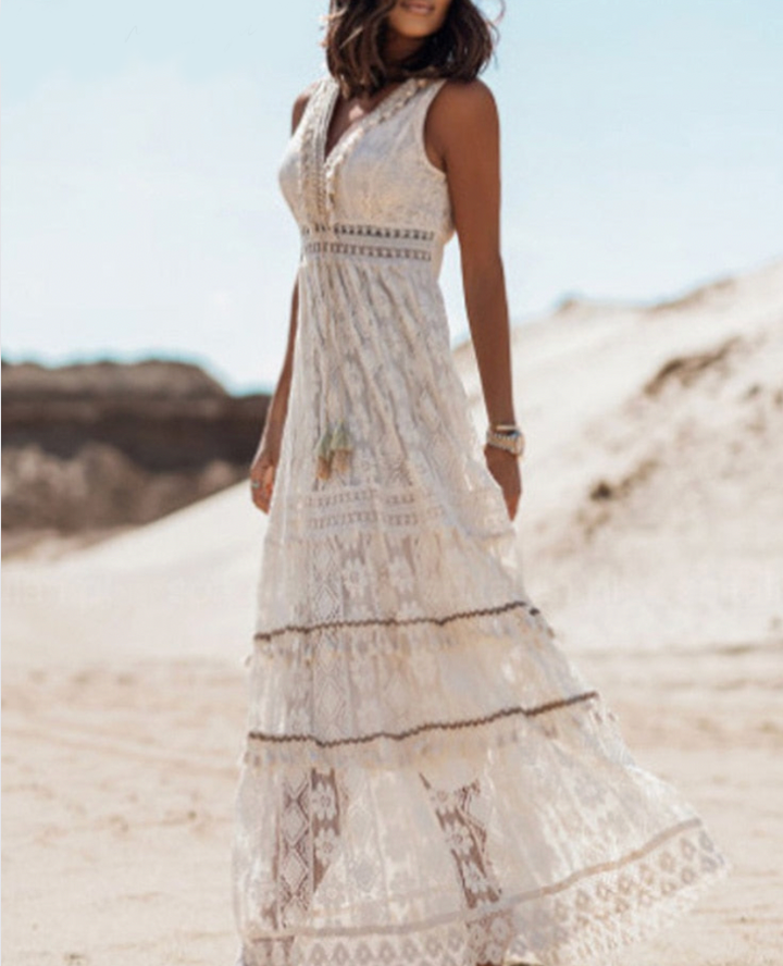 Stylish women's boho flowing maxi dress, perfect for festival fashion & warm weather comfort.