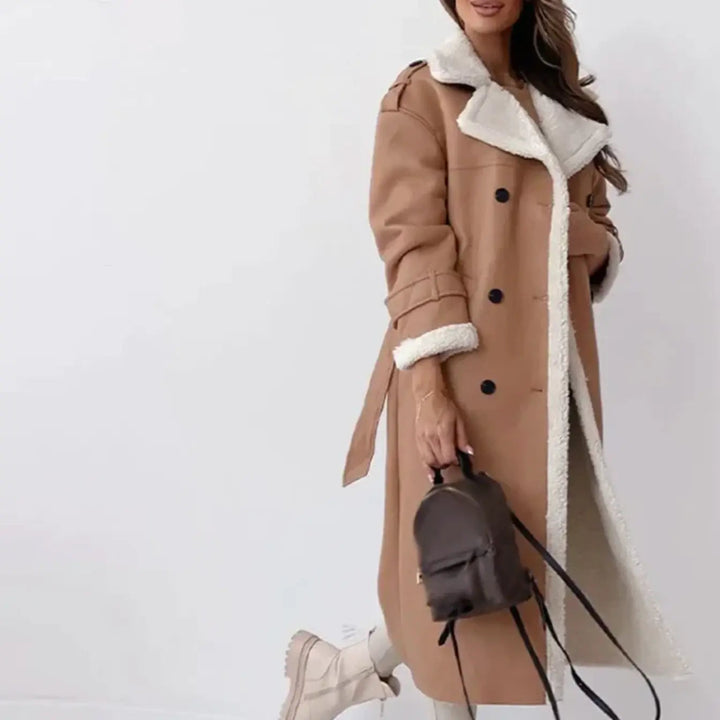 Sophisticated women's long classic coat, ideal for winter fashion. Elegant, timeless outerwear for cold weather.