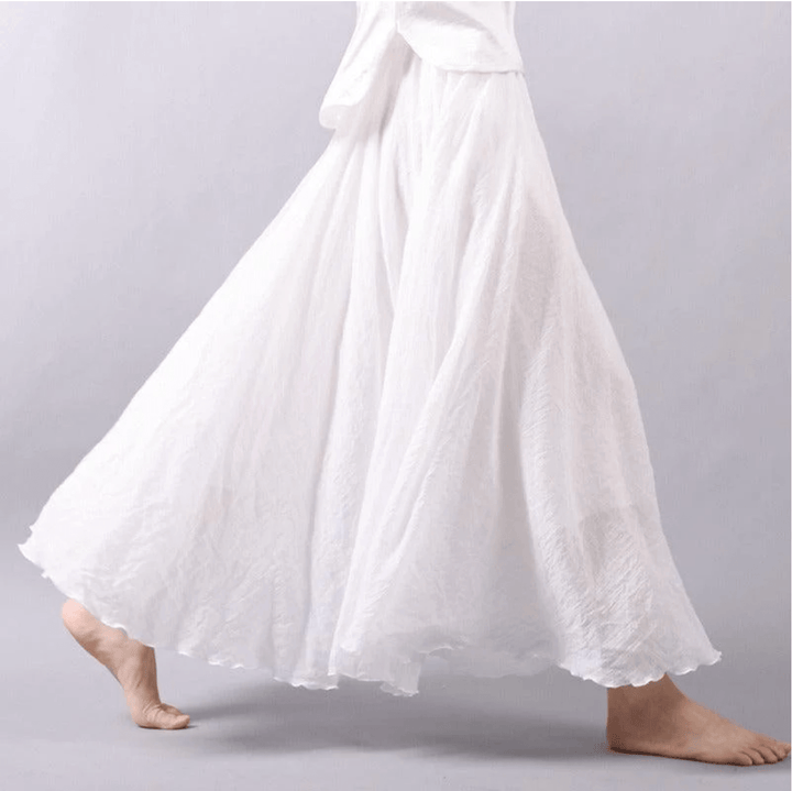Blue flowy maxi skirt for women, ideal for bohemian beach fashion & elegant casual summer outfits. Comfortable style.