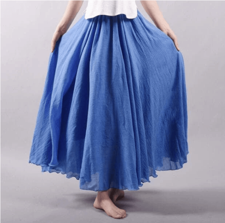 White flowy maxi skirt, a comfortable & chic women's summer essential, perfect for bohemian style & vacation wear.