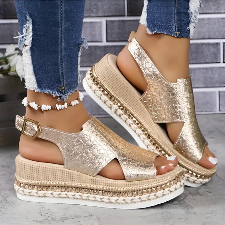 Women's elegant silver sandals, combining fashionable design with orthopedic comfort and supportive fit.