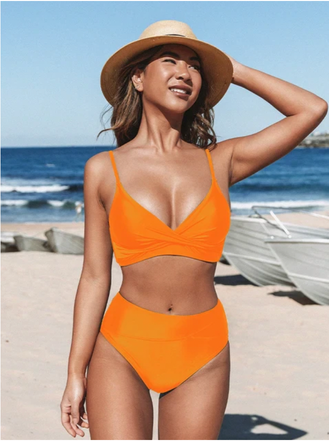 Elegant women's high waist bikini set. Stylish two-piece swimwear perfect for flattering beach & pool days this summer.
