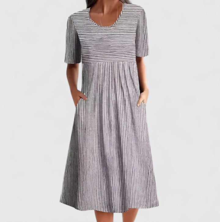Elegant women's blue & grey striped midi dress, perfect for casual summer style with its comfortable fabric and pockets.