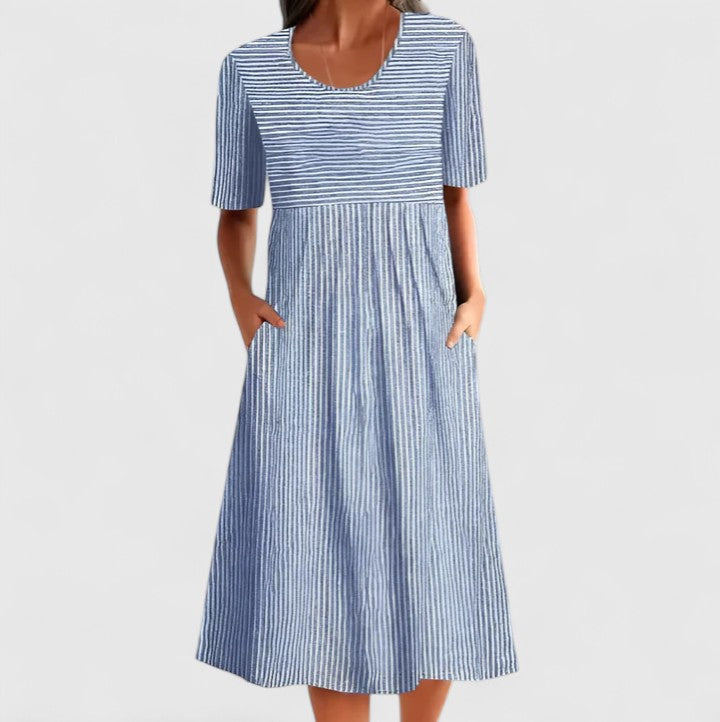 Women's comfortable striped midi dress for summer elegance, featuring button detail, pockets, and below-knee length.