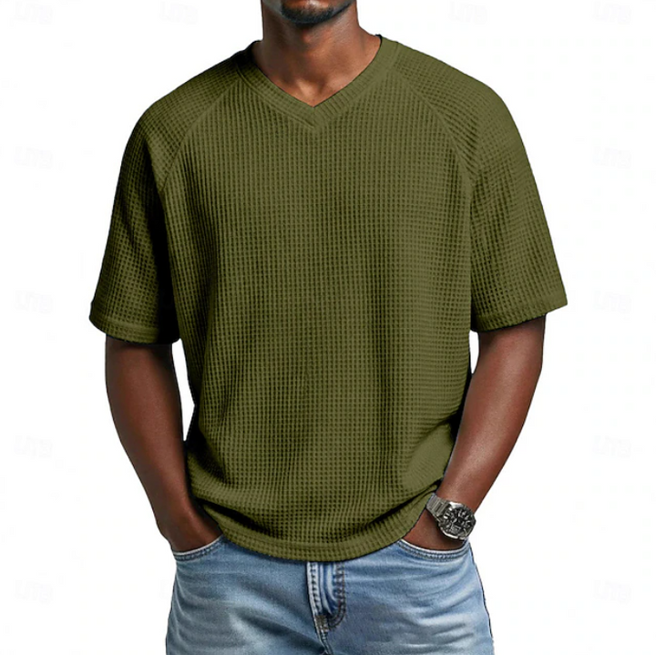 Summer-ready men's short sleeve V-neck shirt. Features a breathable textured design for ultimate comfort.