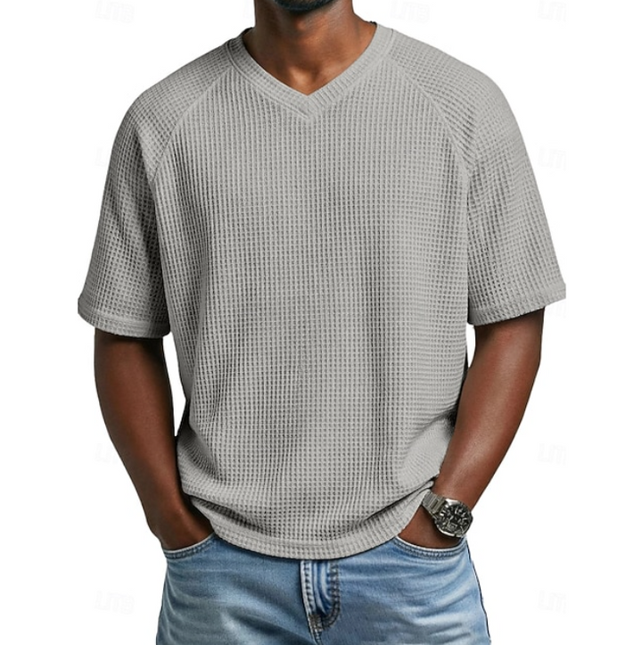 Effortlessly stylish men's V-neck short sleeve shirt. Textured fabric offers a comfortable, versatile look.
