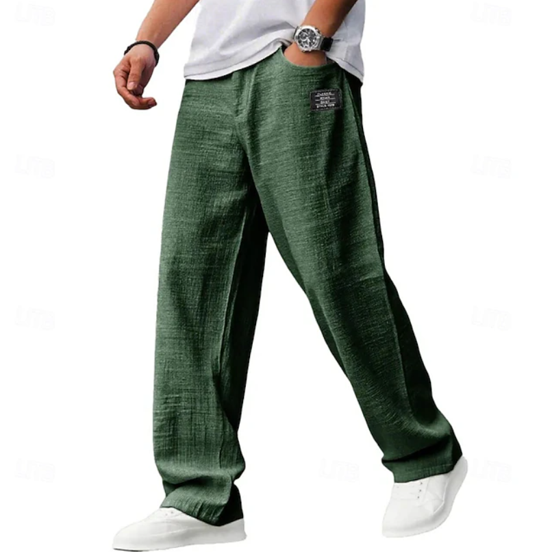Stylish man wearing versatile loose fit comfort pants with a casual top, a men's fashion essential.