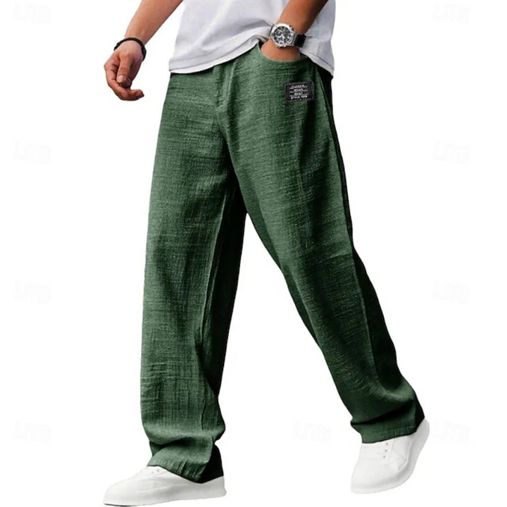 Stylish man wearing versatile loose fit comfort pants with a casual top, a men's fashion essential.
