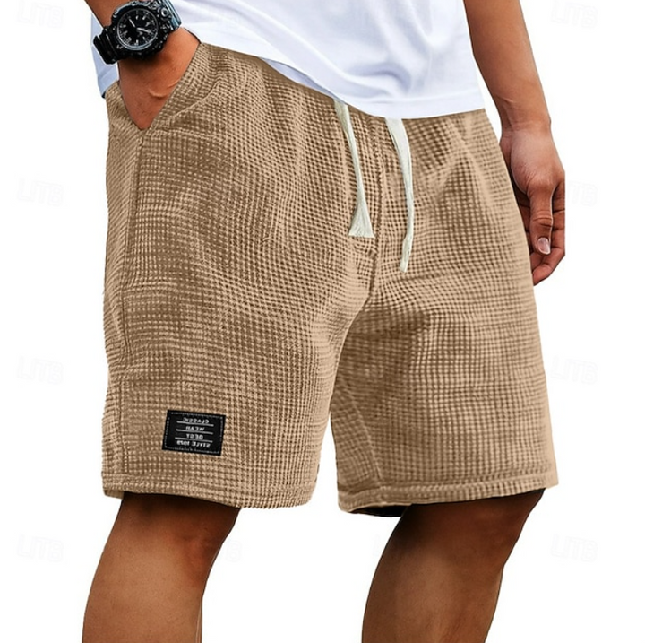 Close-up of the durable yet soft fabric of Men's Oliver casual summer shorts, suitable for warm weather.