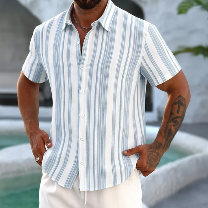 Close-up of a men's relaxed fit striped button-up shirt. Perfect casual shirt for a stylish men's outfit.