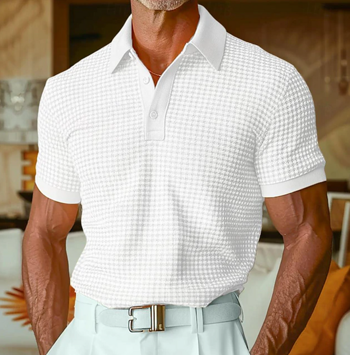 Close-up of men's textured waffle knit shirt fabric, highlighting its unique pattern & casual comfort.
