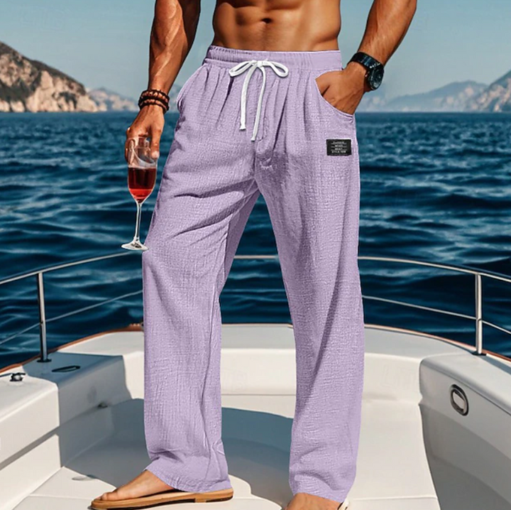Lightweight men's loose fit trousers with elastic drawstring waist for summer comfort.