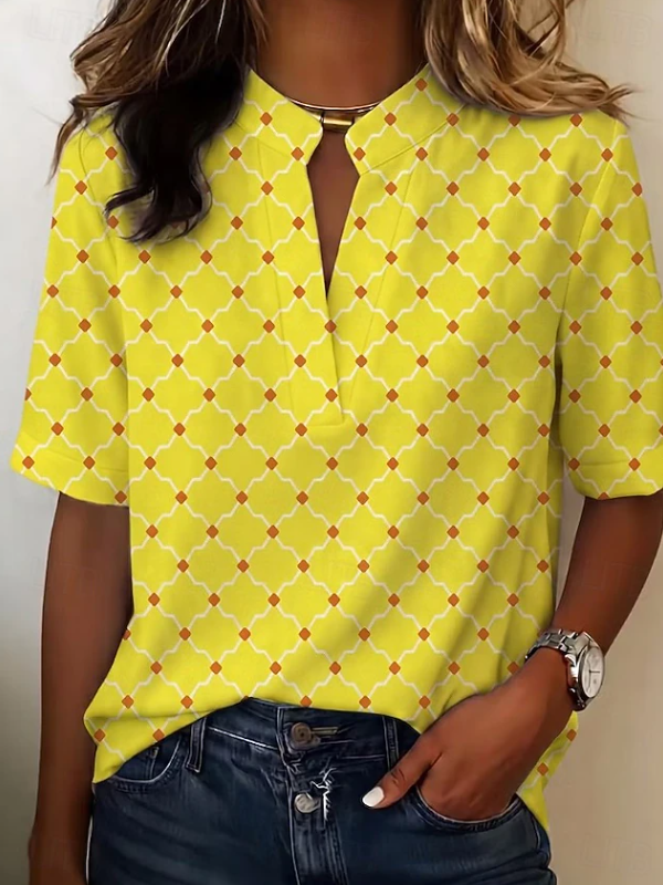Colorful patterned women's Mila blouse with geometric print and a chic buttoned Henley neckline.