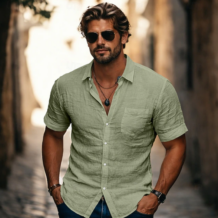Man wearing a comfortable casual short sleeve button-up shirt, perfect for warm weather and relaxed style.
