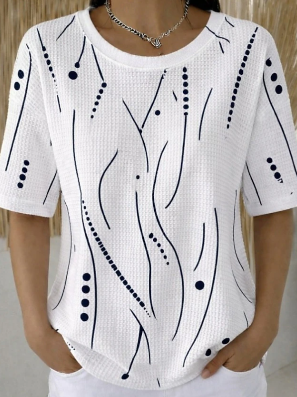 Elegant women's blouse featuring a distinct textured wave design and short sleeves. Ideal for stylish summer outfits.