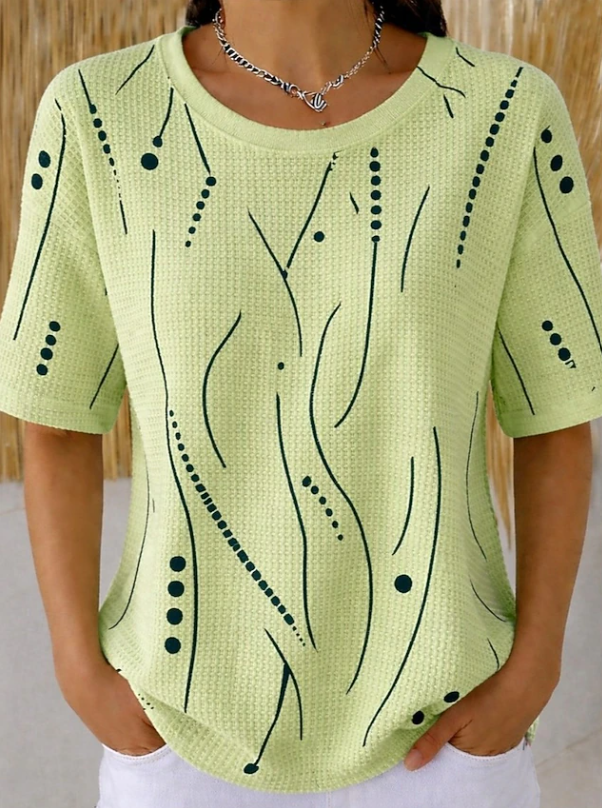 Casual women's short sleeve top with a unique textured wave design. Relaxed fit blouse for comfortable everyday style.