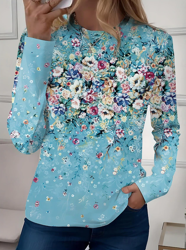 Comfortable women's casual floral top. Long sleeve, crew neck, and relaxed fit for versatile everyday comfort.