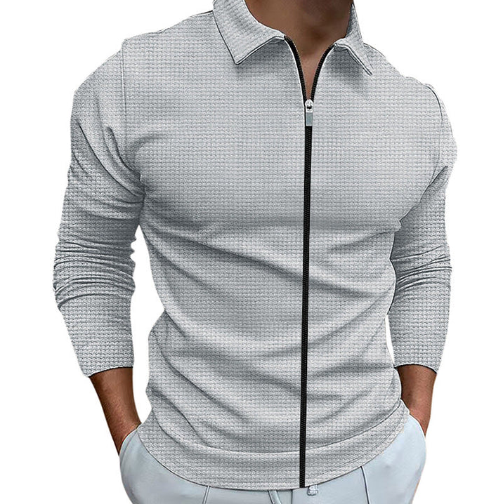 Close-up of stylish men's long sleeve zip-up shirt featuring an elegant collar and comfortable fabric.