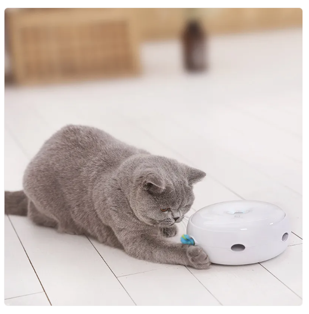 Automatic interactive cat toy with a vibrant rainbow feather for engaging feline play & enrichment.